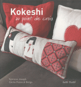 Kokeshi au point de croix